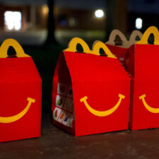 Three red and yellow McDonalds happy meal boxes